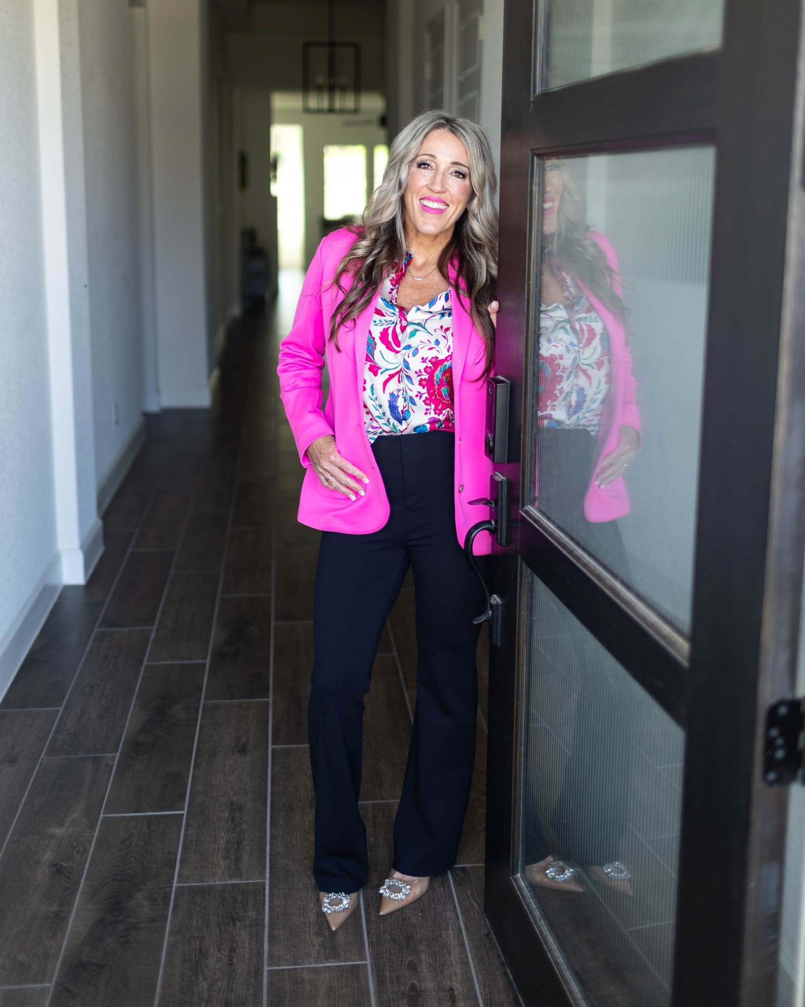 Dr. Erin Hudson at the front door of a property